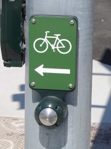 Sign - press button for bikes to cross